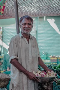 Man selling vegetables