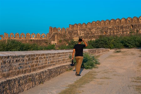 Man walking in Rohtas Fort towards the wall