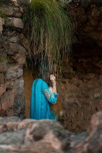 Back view of a girl in Pakistani dress standing in Rohtas Fort