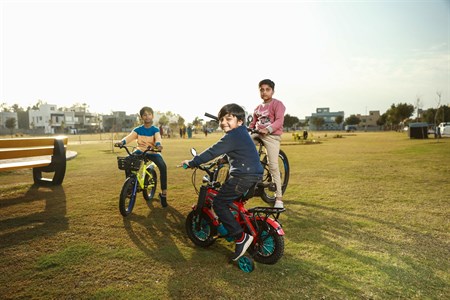 Kids on bicycle in playground