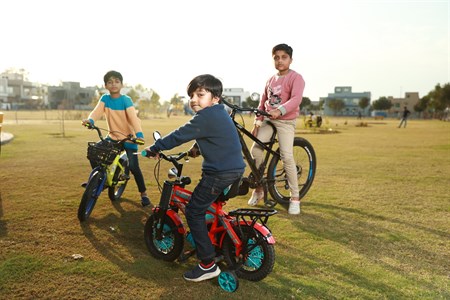 Kids on bicycle in playground