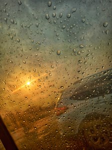 Rain drops on the glass during sunset