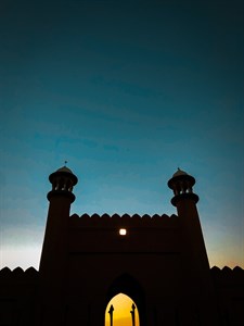 A beautiful sunset behind a mosque 