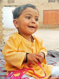 CHILD Photos on traditional bed