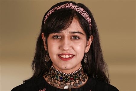 North girl in traditional clothes smiling