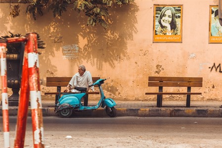 Man sitting with scooter