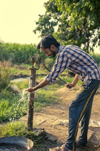 Boy using handpump (water) | Punjab Culture